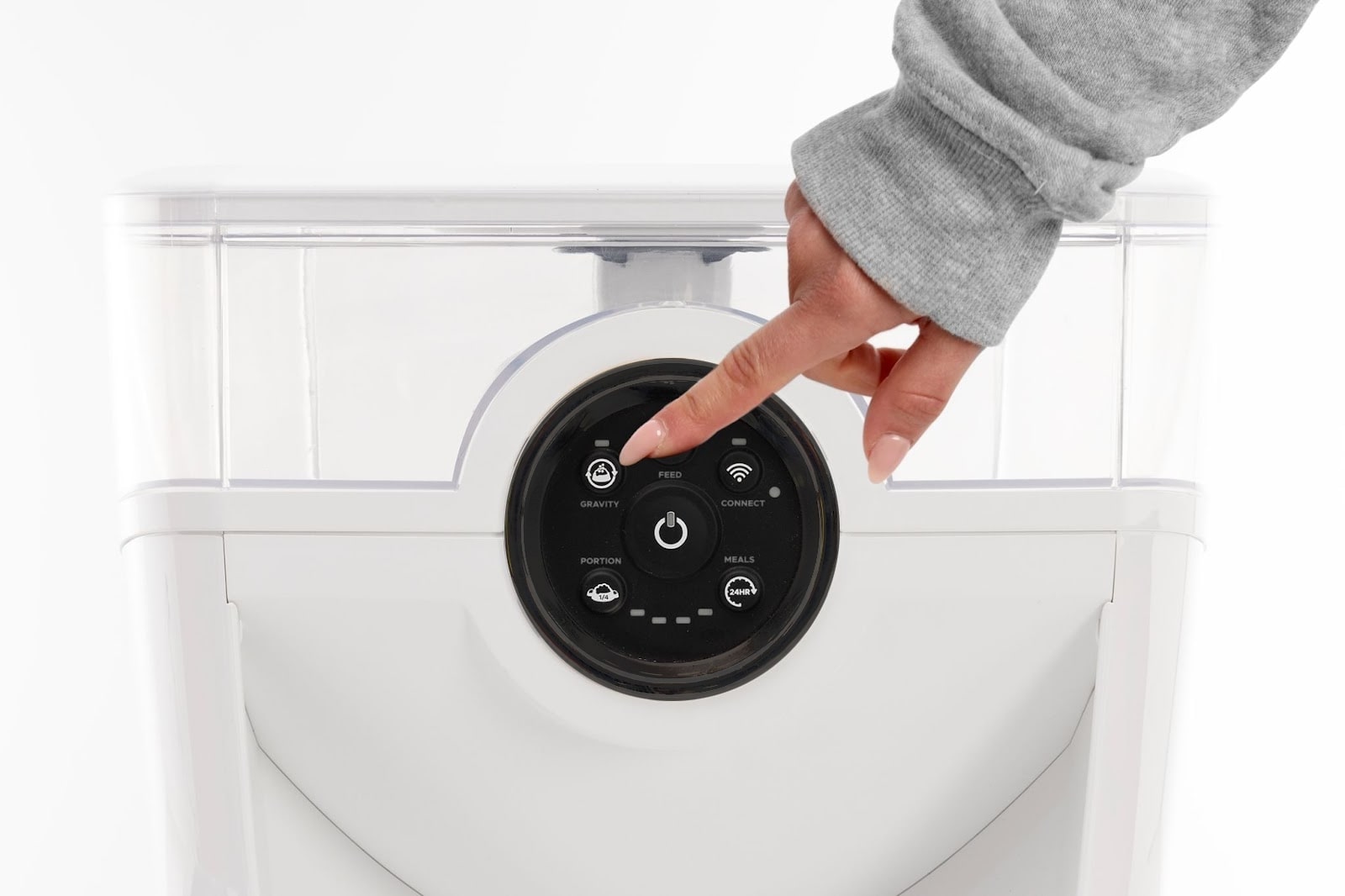 Performing a test dispense by pressing the ‘Feed’ button on the control panel