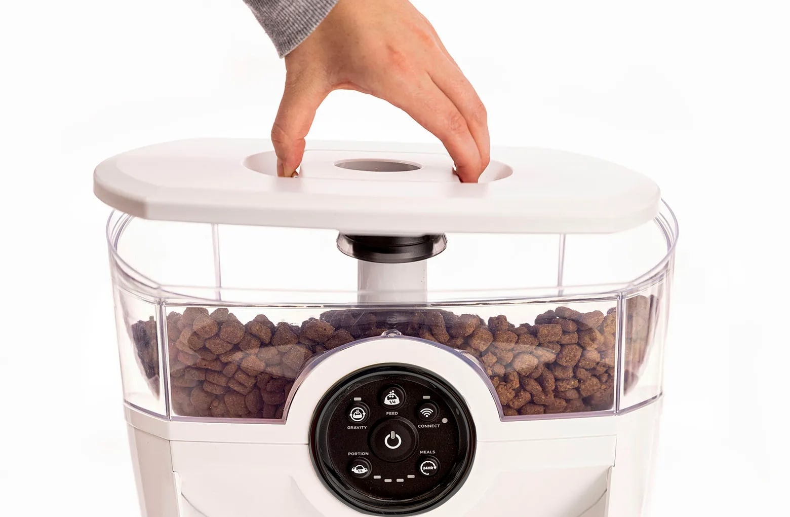 Removing the Feeder-Robot hopper lid by squeezing the release in the center of the lid