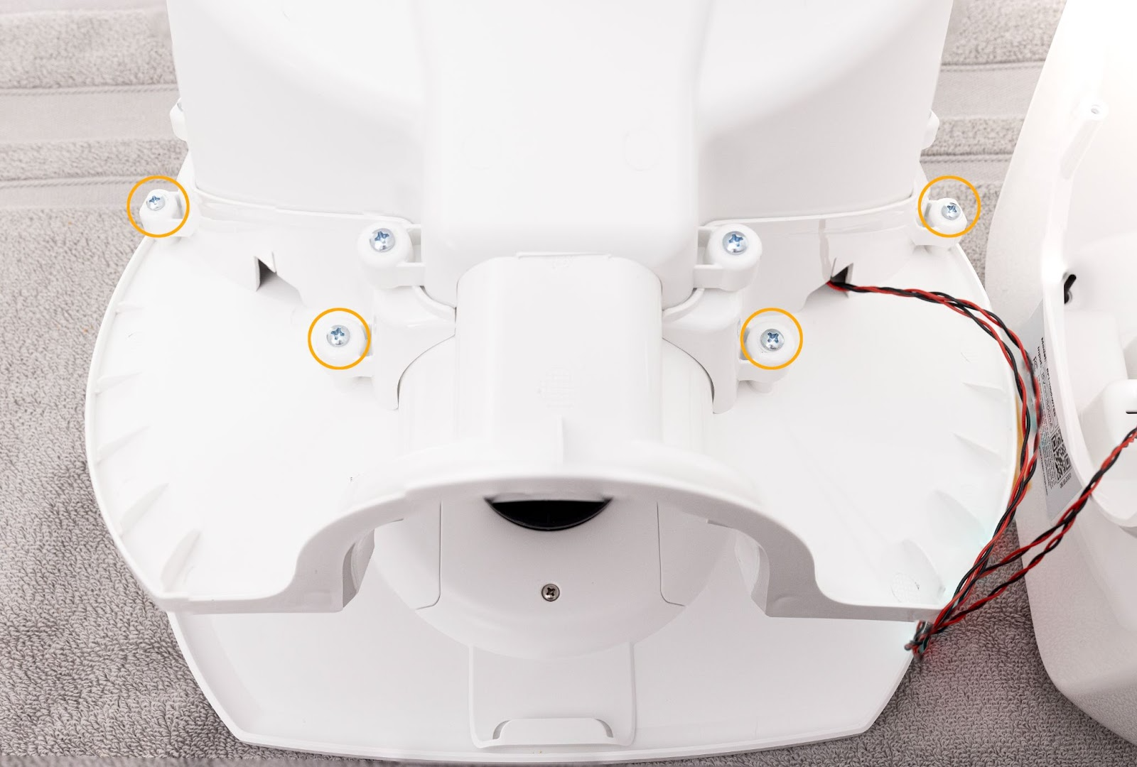 Removing four screws from the bowl