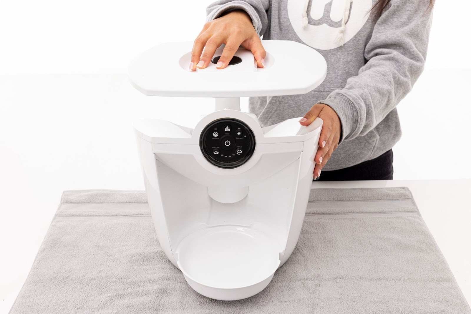 Replacing the lid and make sure it locks in place 