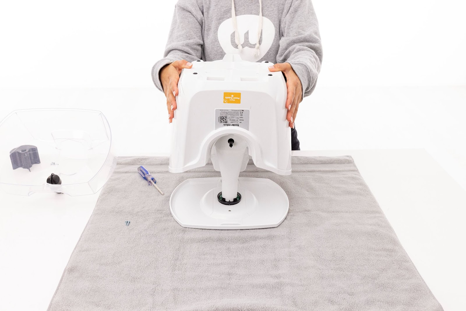 Reinstalling the base to Feeder-Robot and two screws on the bottom of the base